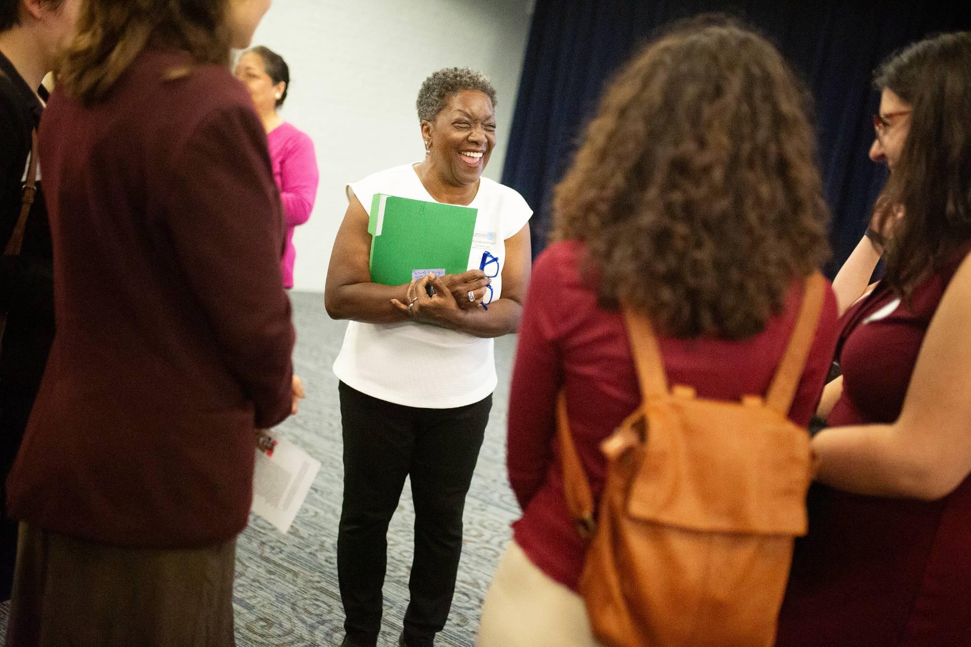 woman talking to others